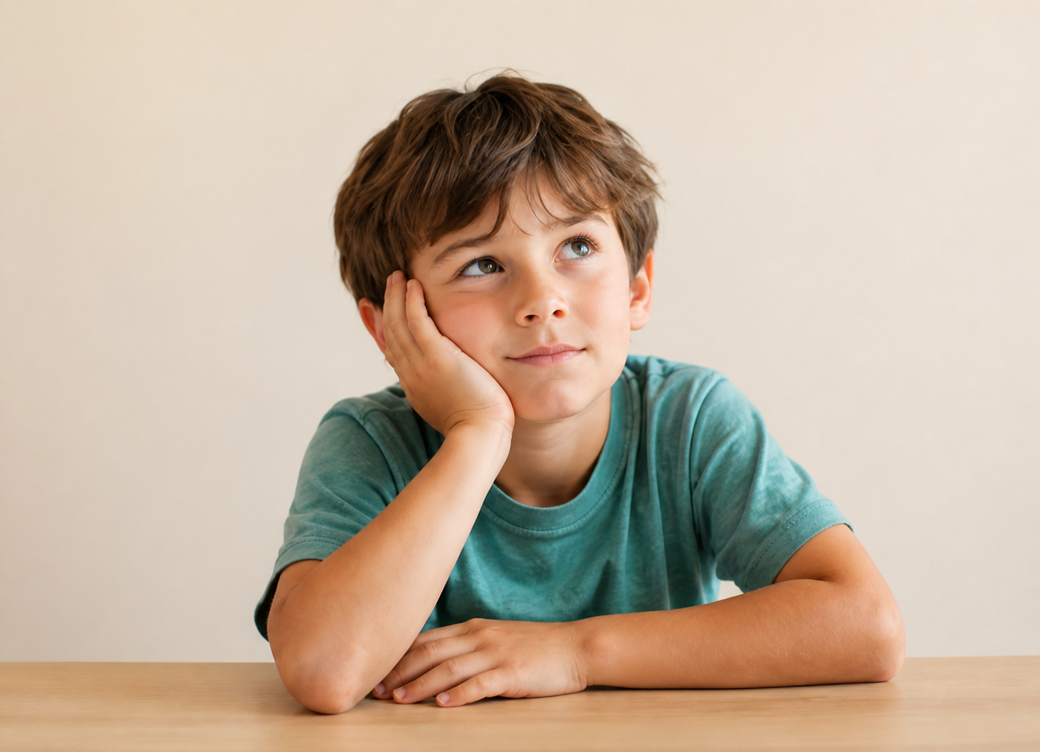 Student thinking at a table